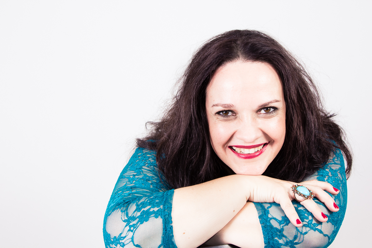 Smiling on folded arms.jpg